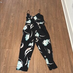 1. State Black Jumpsuit with Floral Pattern